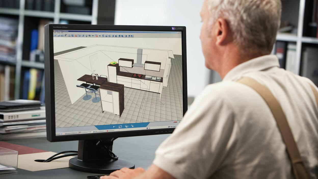 Planungsdarstellung einer Küche in 3D am Computer durch Tischler